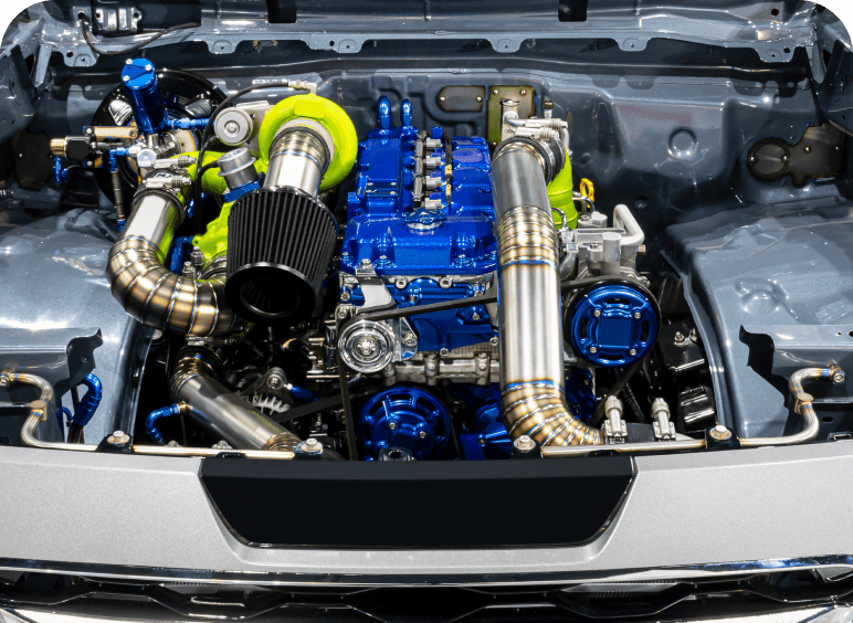 A high-performance car engine with blue and metallic components.