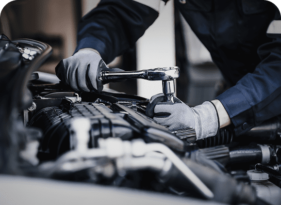 Mechanic working on car engine